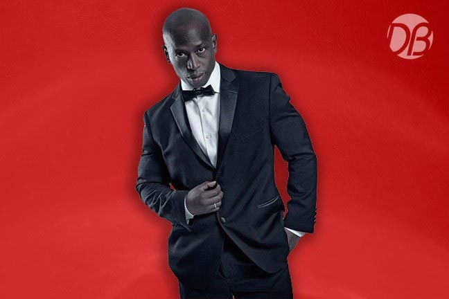 Paul Anthony in a tuxedo on a red Dreambody background
